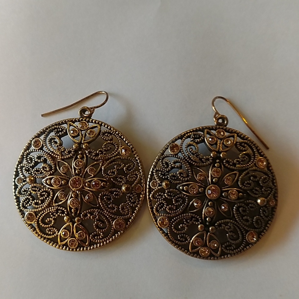 Gold and black colored earrings with  rhinestones